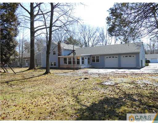 8 Nottingham Road Edison, NJ 08820 - Photo 12 of 15 a house with trees in front of it