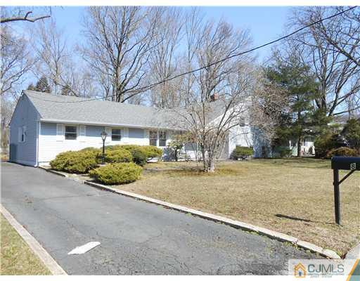 8 Nottingham Road Edison, NJ 08820 - Photo 15 of 15 a front view of a house with a yard and trees