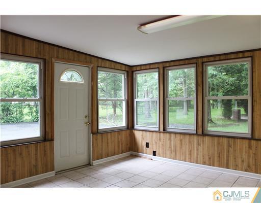 8 Nottingham Road Edison, NJ 08820 - Photo 5 of 15 a view of an empty room with a window