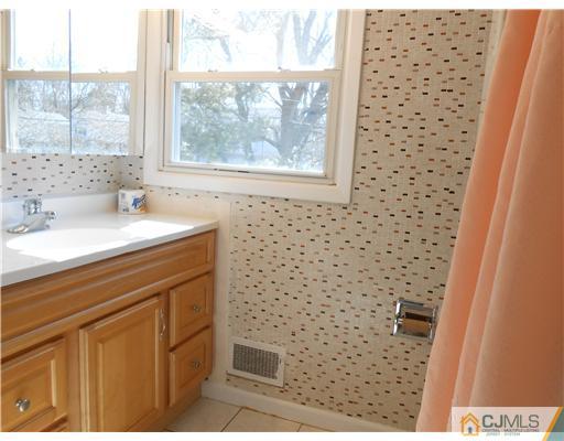 8 Nottingham Road Edison, NJ 08820 - Photo 9 of 15 a bathroom with a sink and a shower