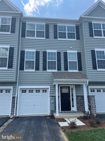 a view of a brick house with many windows