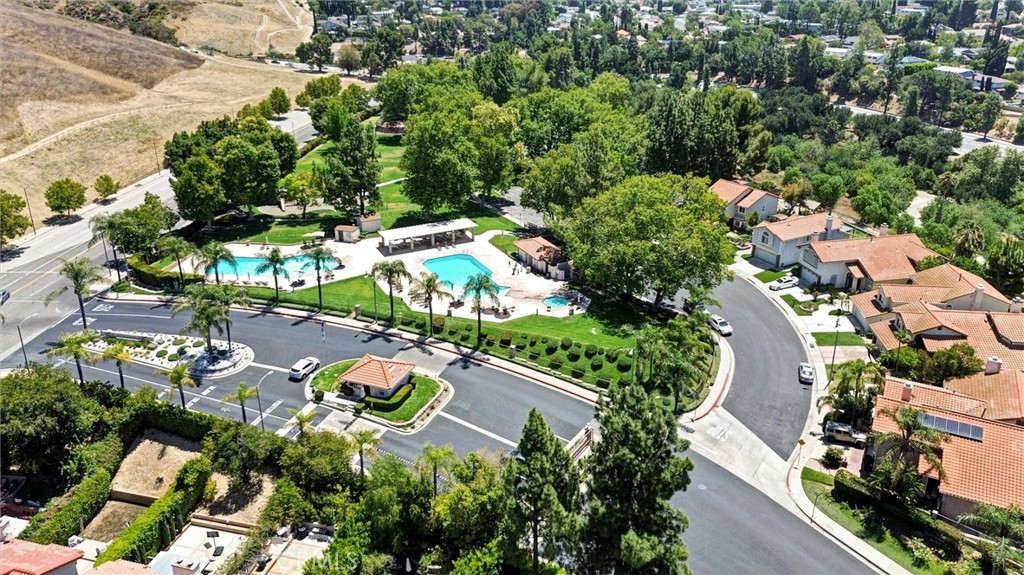 19605 Shadow Springs Way Porter Ranch, CA 91326 - Photo 27 of 33 Drone shot of community entrance & pools.