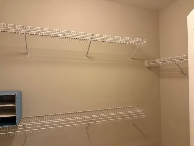 a view of a room with racks on the wall