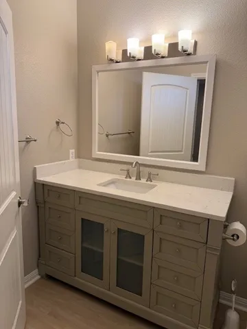 a bathroom with a sink and a mirror