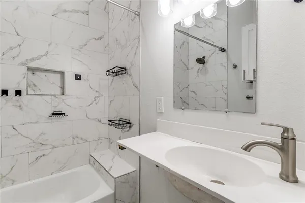 a bathroom with a sink and a bathtub