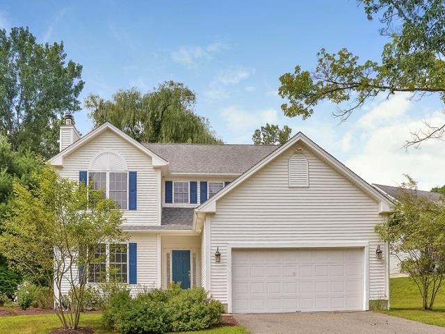 Front of the house with level driveway with two car garage