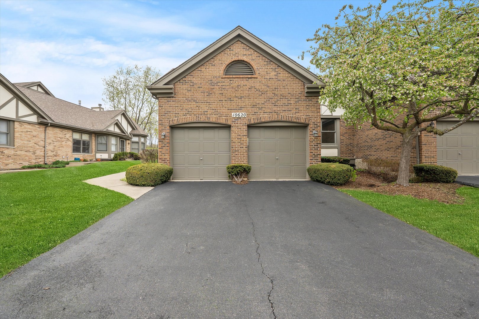 10620 Golf Road Orland Park, IL 60462 - Photo 1 of 42 a front view of a house with garden
