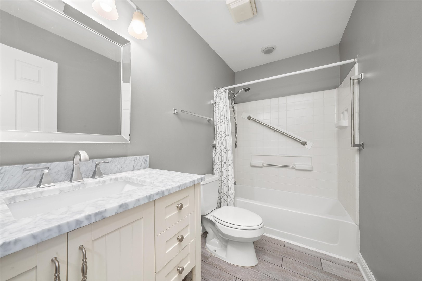 10620 Golf Road Orland Park, IL 60462 - Photo 20 of 42 a bathroom with a granite countertop sink toilet and shower