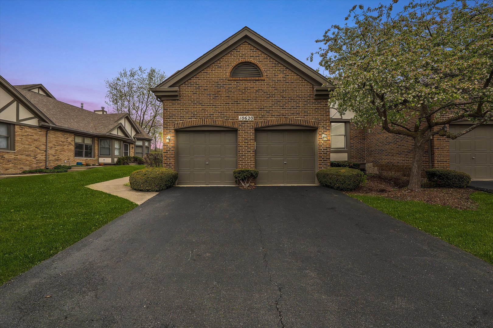 10620 Golf Road Orland Park, IL 60462 - Photo 2 of 42 a front view of a house with a yard and garage