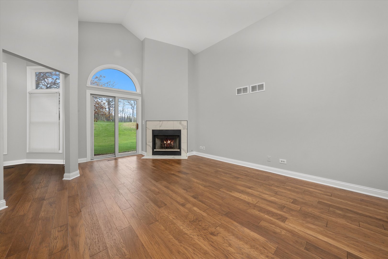 10620 Golf Road Orland Park, IL 60462 - Photo 4 of 42 a view of empty room with wooden floor and fan