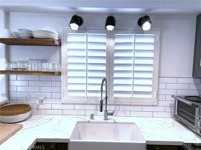 a kitchen with a sink and a stove