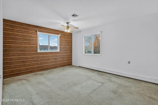 a view of an empty room with a bathroom