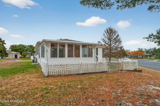 a front view of a house with a fence