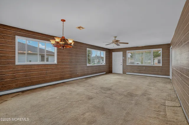 a view of an empty room with windows