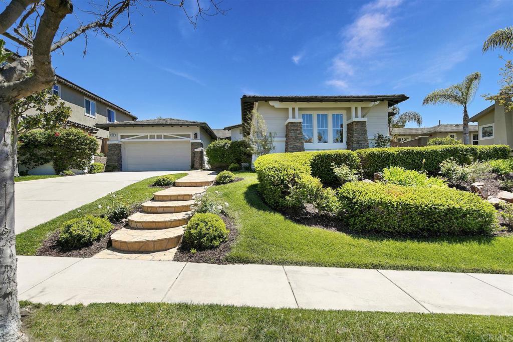 1435 Ravean Court Encinitas, CA 92024 - Photo 19 of 48 a front view of a house with a yard