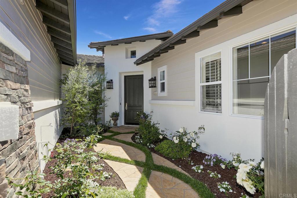1435 Ravean Court Encinitas, CA 92024 - Photo 20 of 48 a front view of a house with a yard