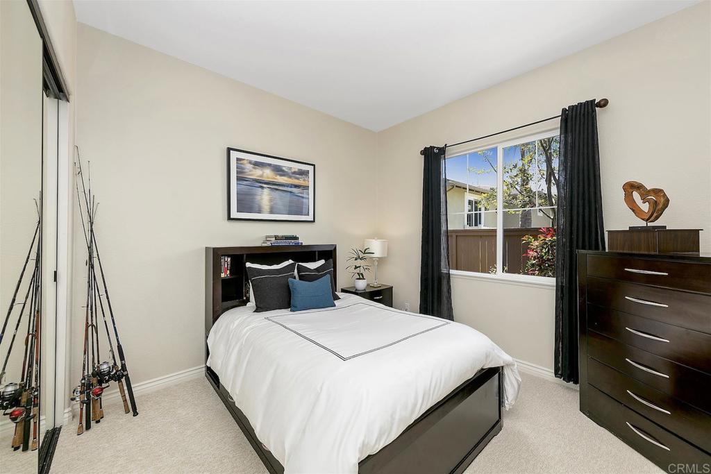 1435 Ravean Court Encinitas, CA 92024 - Photo 31 of 48 a bedroom with a bed and a dresser
