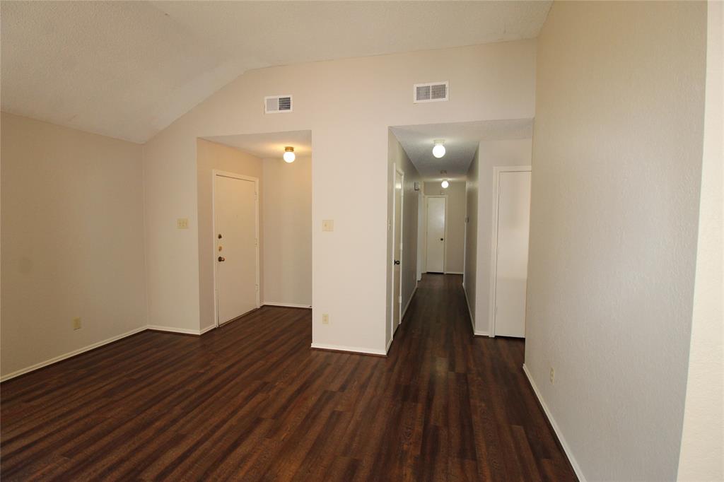 2309 Lakeshore Lane Rowlett, TX 75088 - Photo 11 of 25 a view of a hallway with wooden floor
