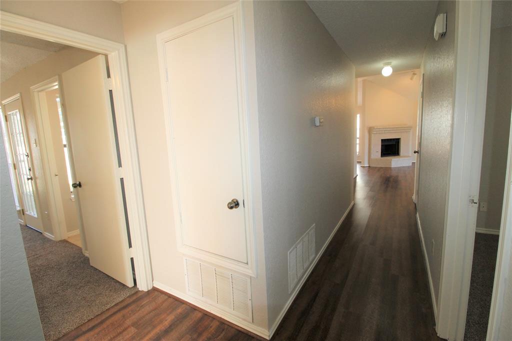 2309 Lakeshore Lane Rowlett, TX 75088 - Photo 21 of 25 a view of a hallway with wooden floor and staircase