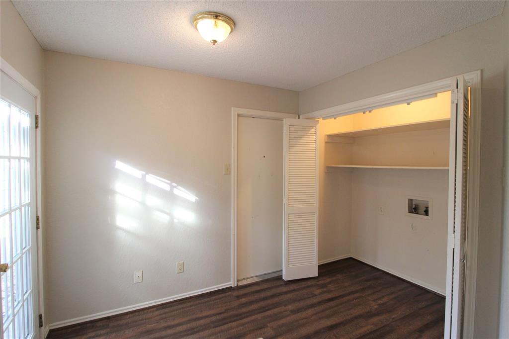 2309 Lakeshore Lane Rowlett, TX 75088 - Photo 10 of 25 an empty room with wooden floor and windows