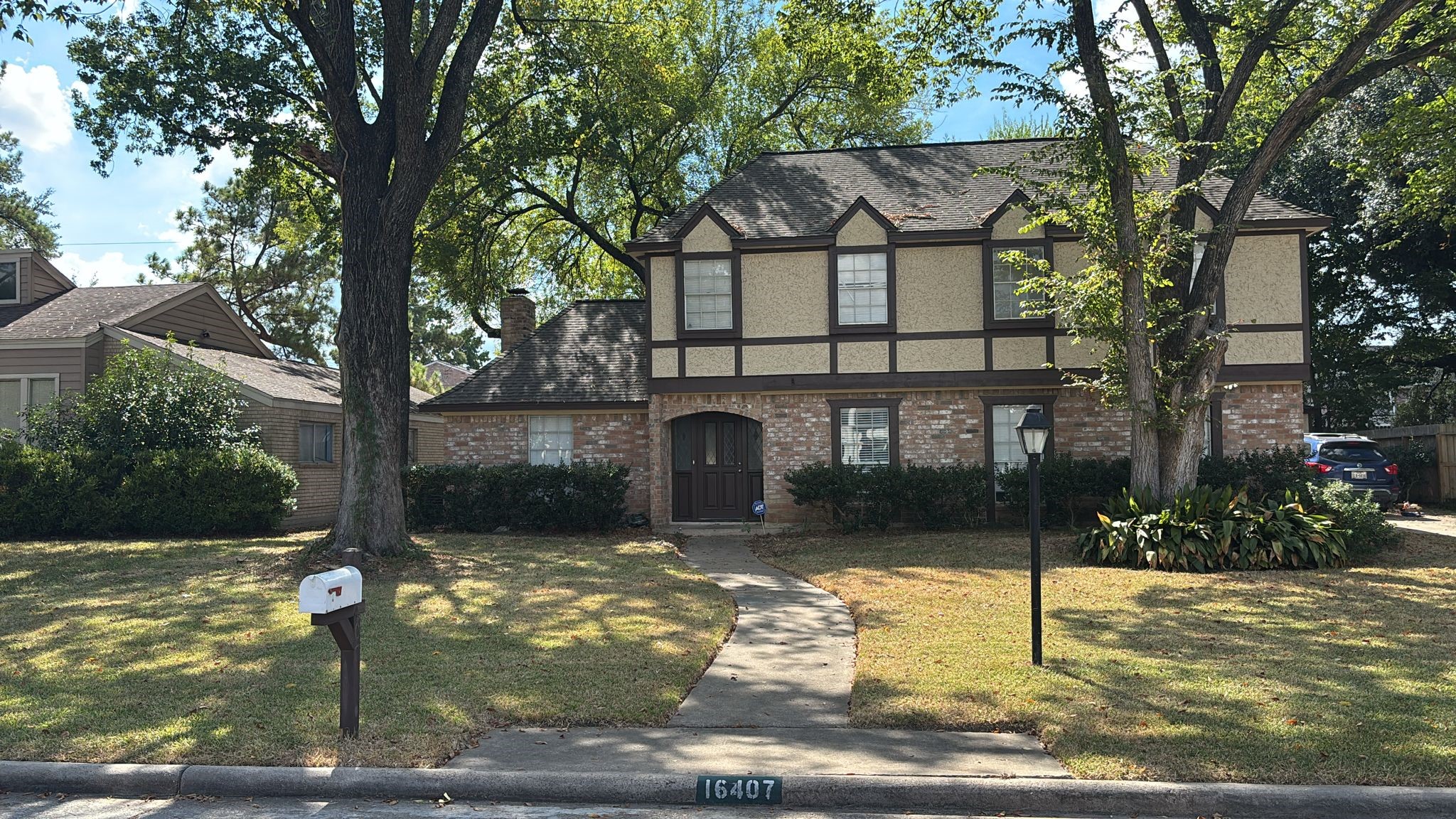16407 Southampton Drive Spring, TX 77379 - Photo 2 of 12 a front view of a house with garden