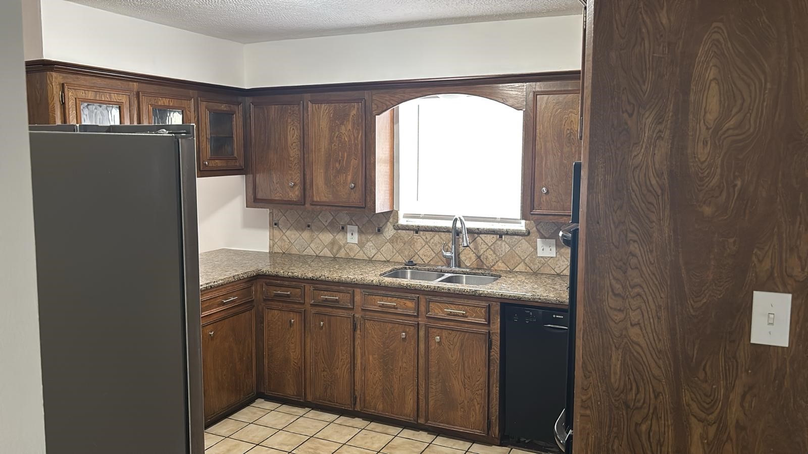 16407 Southampton Drive Spring, TX 77379 - Photo 4 of 12 a bathroom with a granite countertop sink a mirror and a vanity