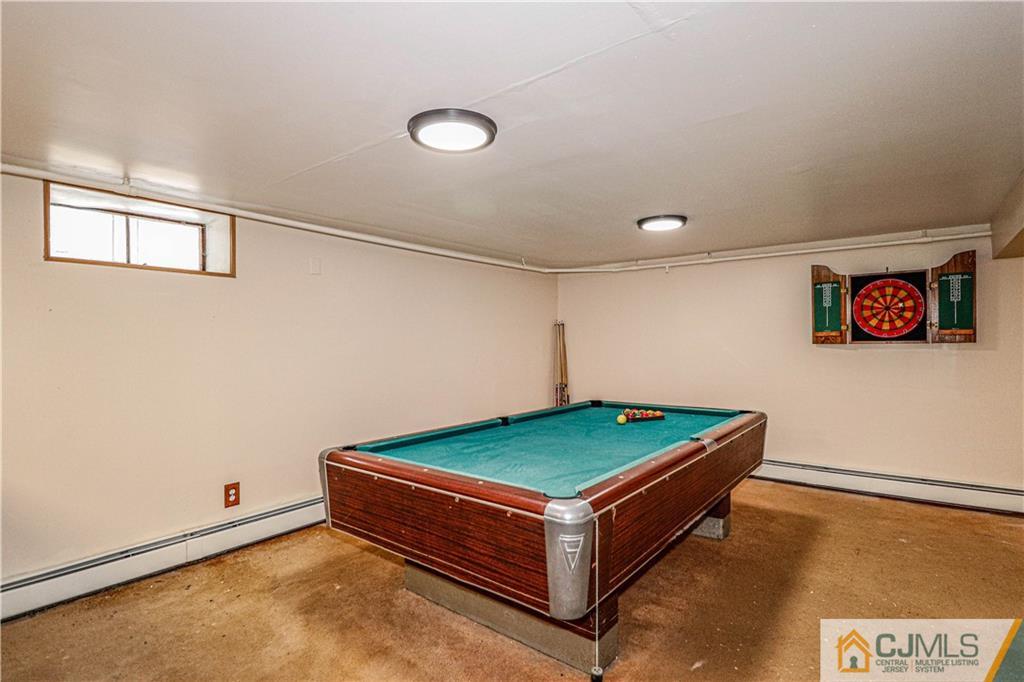 55 3rd Street Edison, NJ 08837 - Photo 17 of 27 a room with pool table and windows