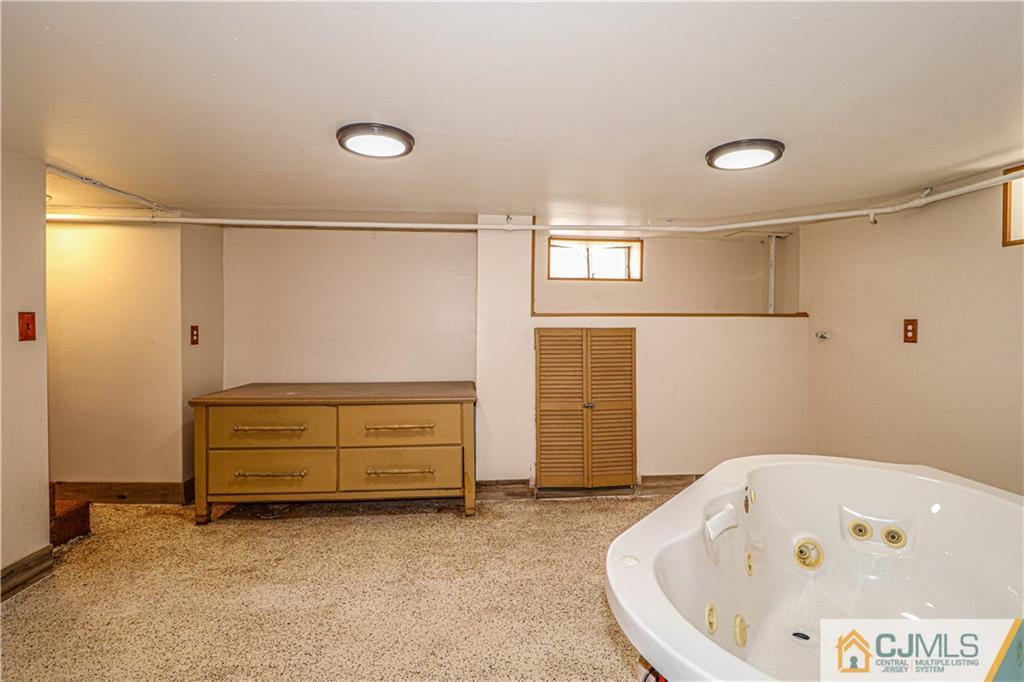 55 3rd Street Edison, NJ 08837 - Photo 18 of 27 a bathroom with a tub and shower