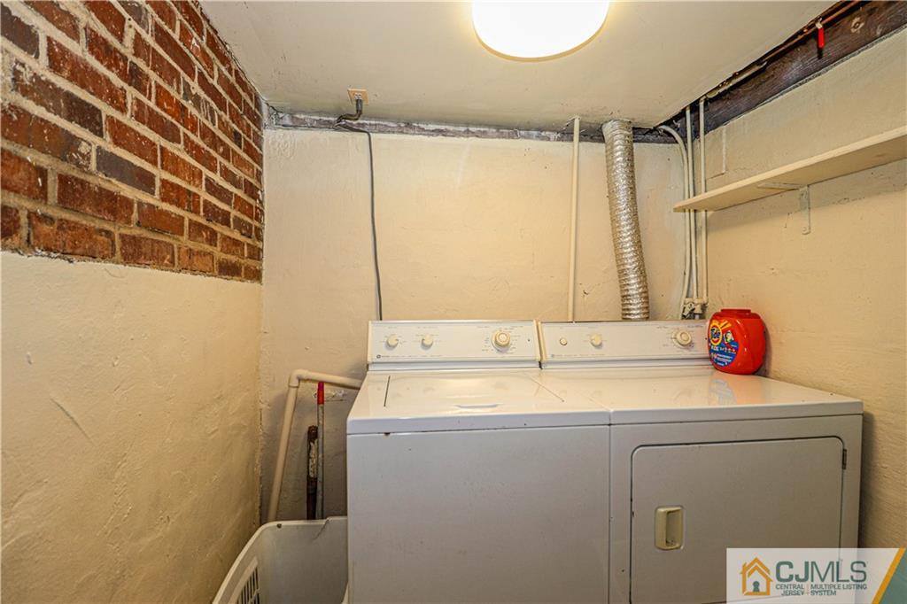 55 3rd Street Edison, NJ 08837 - Photo 19 of 27 a bathroom with a sink and a shower