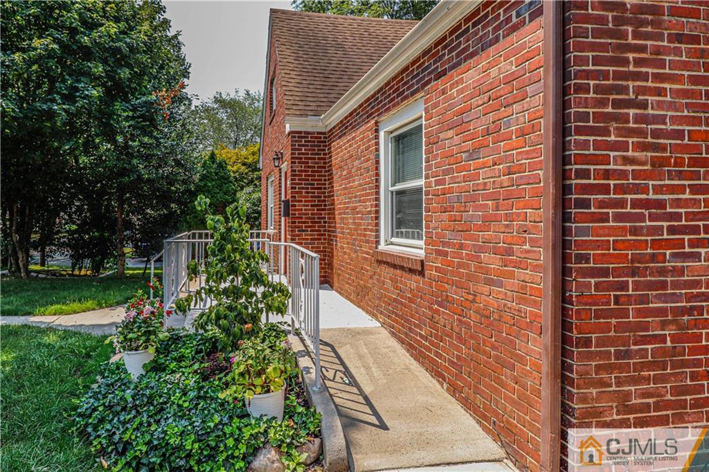 55 3rd Street Edison, NJ 08837 - Photo 20 of 27 a brick building with a yard