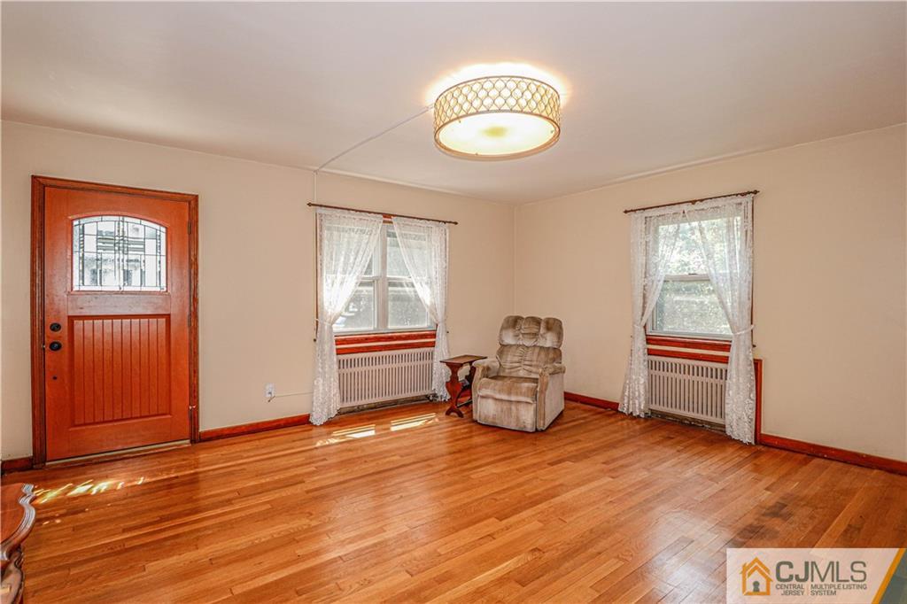 55 3rd Street Edison, NJ 08837 - Photo 3 of 27 a view of livingroom with furniture wooden floor and window