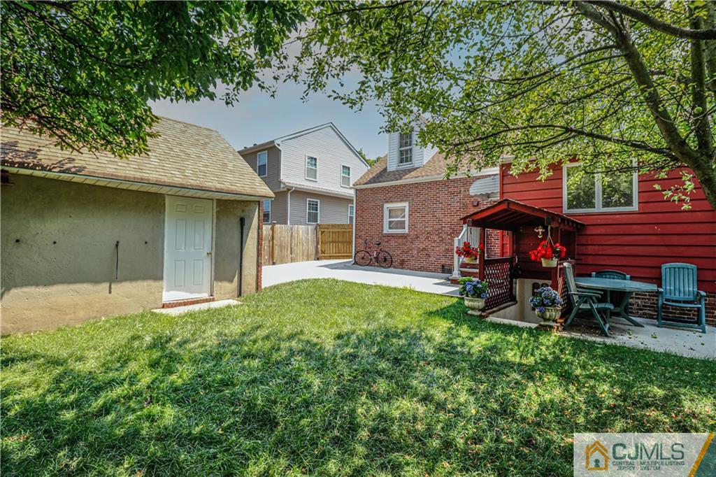 55 3rd Street Edison, NJ 08837 - Photo 26 of 27 a front view of a house with garden