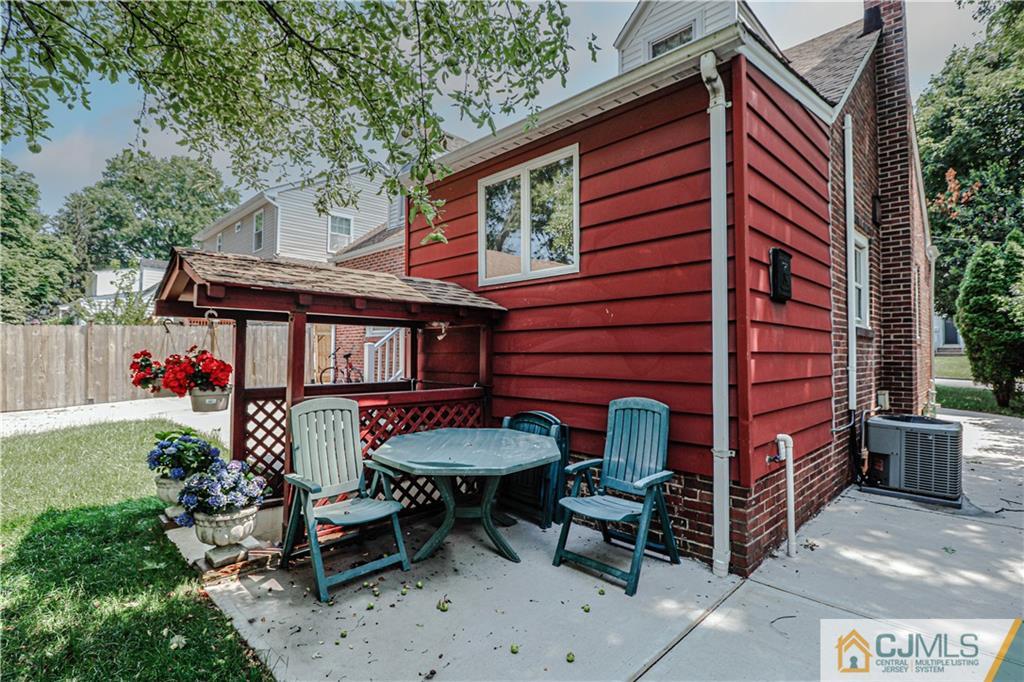 55 3rd Street Edison, NJ 08837 - Photo 27 of 27 a front view of a house with garden and patio