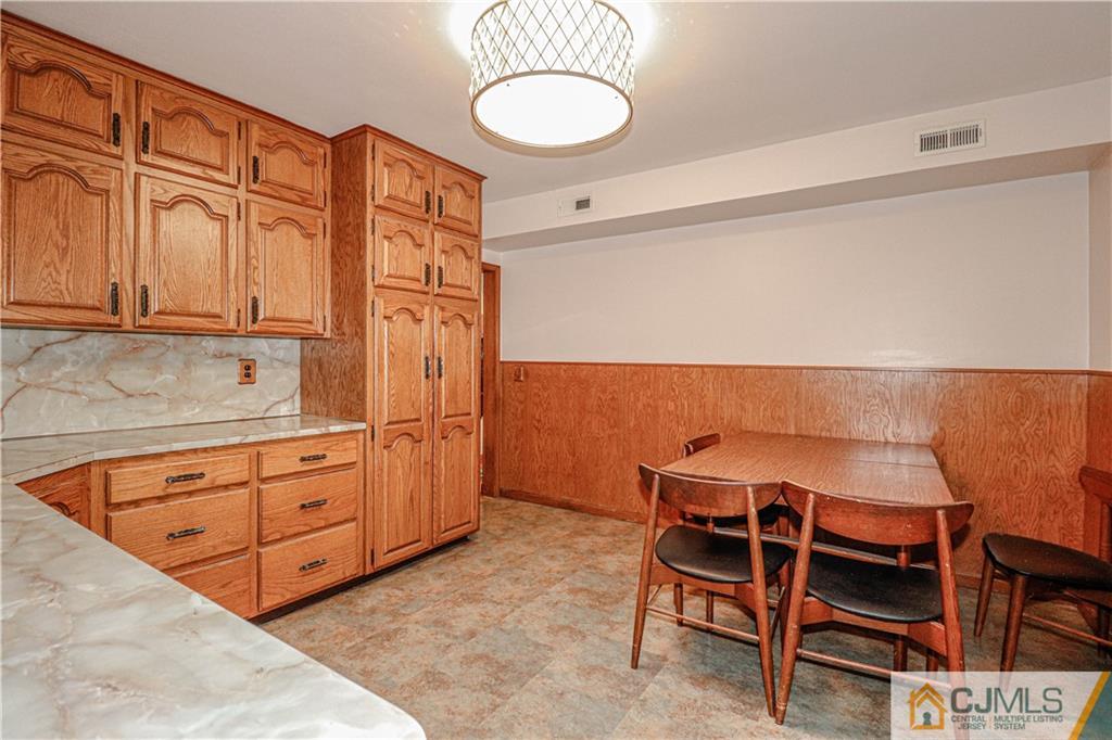 55 3rd Street Edison, NJ 08837 - Photo 6 of 27 a room with furniture a wooden floor and a sink
