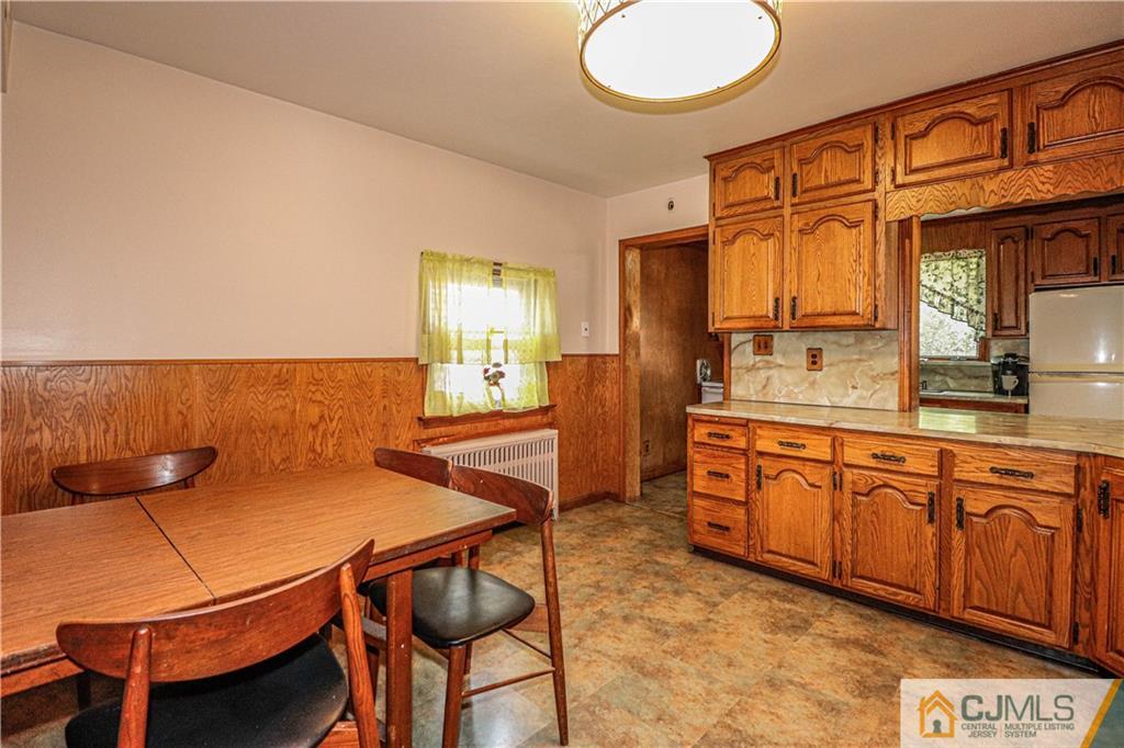 55 3rd Street Edison, NJ 08837 - Photo 7 of 27 a kitchen with a table and chairs in it