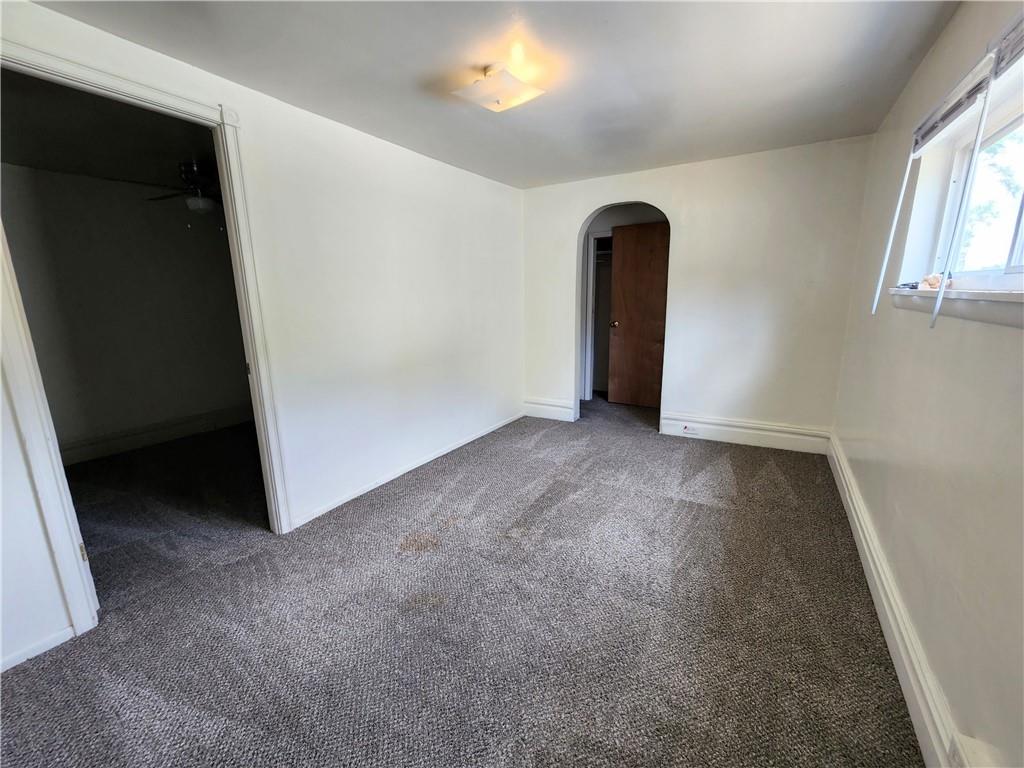 3211 Juliet Street, Unit 1 Pittsburgh, PA 15213 - Photo 5 of 8 wooden floor in an empty room with a window