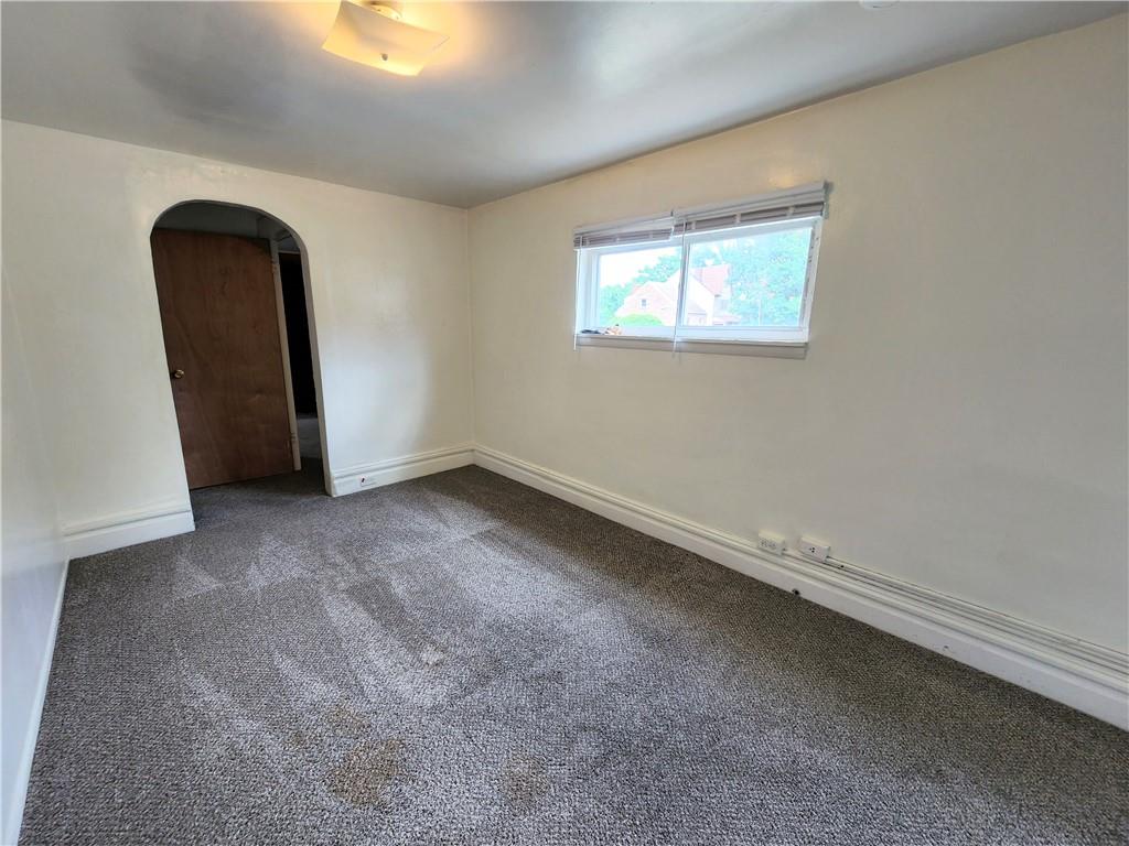3211 Juliet Street, Unit 1 Pittsburgh, PA 15213 - Photo 6 of 8 an empty room with windows