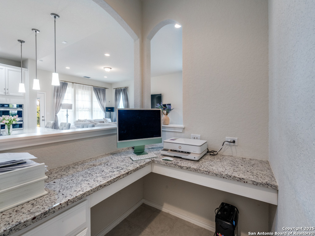 9000 Curling Post Schertz, TX 78154 - Photo 14 of 23 a kitchen with granite countertop a sink and a wooden floor