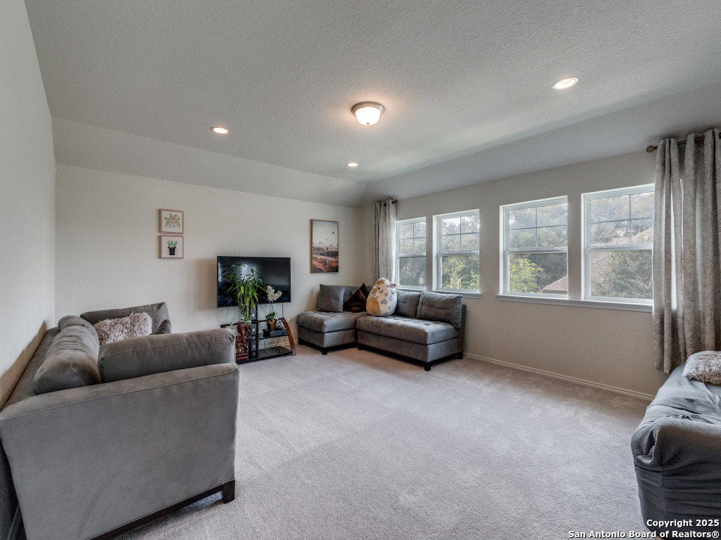 9000 Curling Post Schertz, TX 78154 - Photo 17 of 23 a living room with furniture and a large window