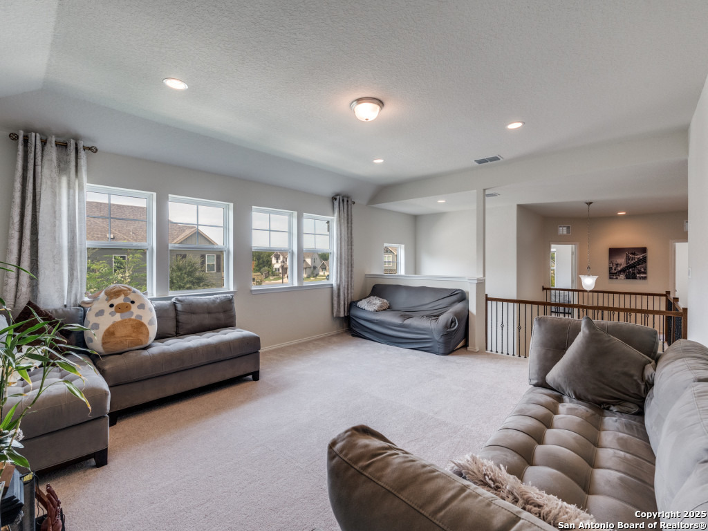 9000 Curling Post Schertz, TX 78154 - Photo 18 of 23 a living room with furniture and a large window
