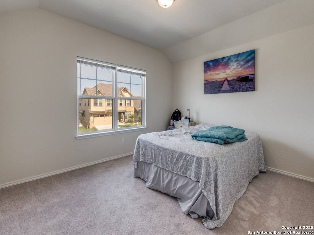 9000 Curling Post Schertz, TX 78154 - Photo 19 of 23 a bedroom with a bed and a window