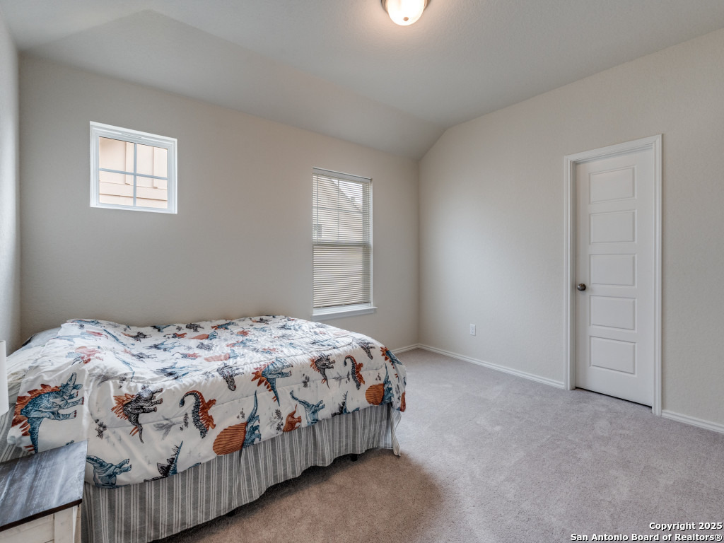 9000 Curling Post Schertz, TX 78154 - Photo 20 of 23 a bedroom with a bed and a window