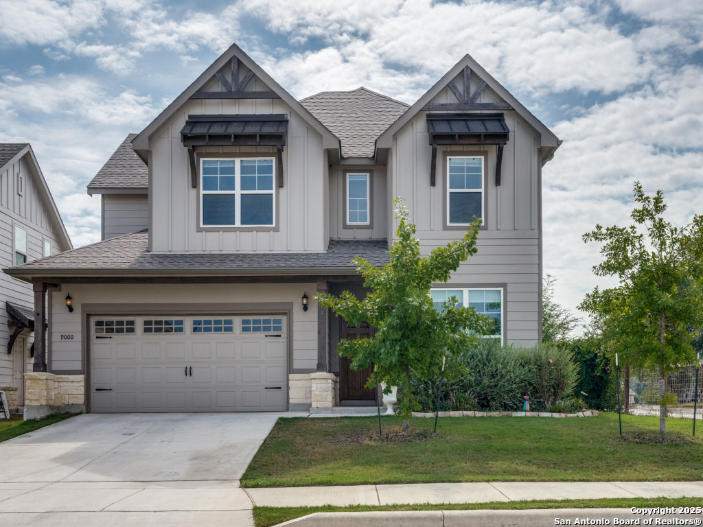 9000 Curling Post Schertz, TX 78154 - Photo 2 of 23 a front view of a house with a yard and garage
