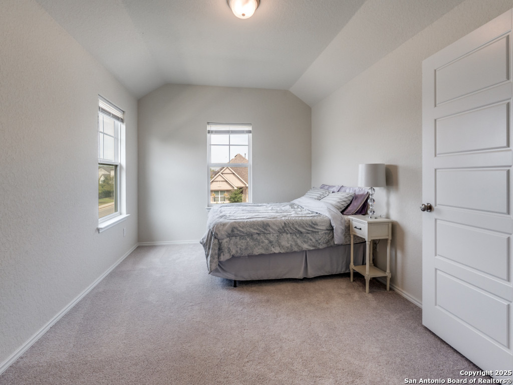 9000 Curling Post Schertz, TX 78154 - Photo 21 of 23 a bedroom with a bed and a window