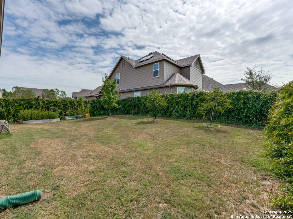 9000 Curling Post Schertz, TX 78154 - Photo 23 of 23 a brick house with a big yard plants and big trees