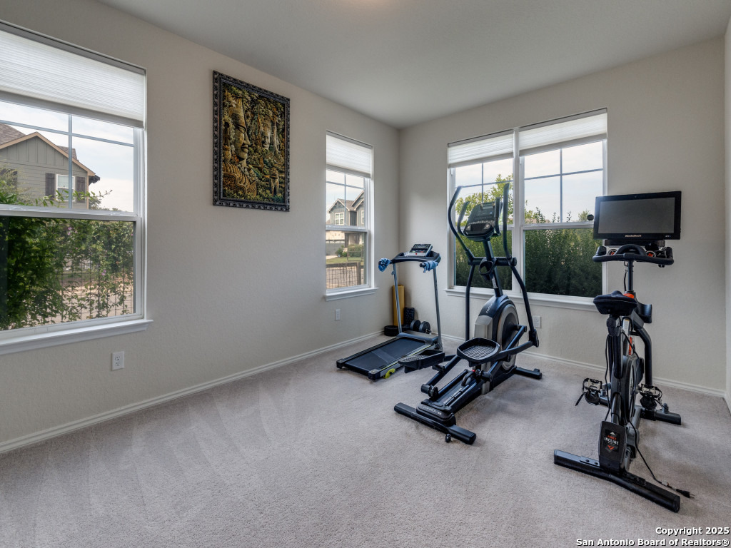 9000 Curling Post Schertz, TX 78154 - Photo 5 of 23 a view of a room with gym equipment
