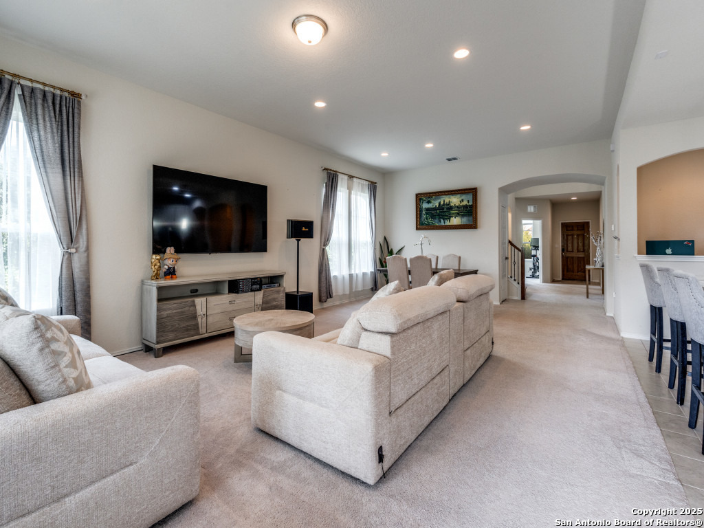 9000 Curling Post Schertz, TX 78154 - Photo 8 of 23 a living room with furniture and a flat screen tv