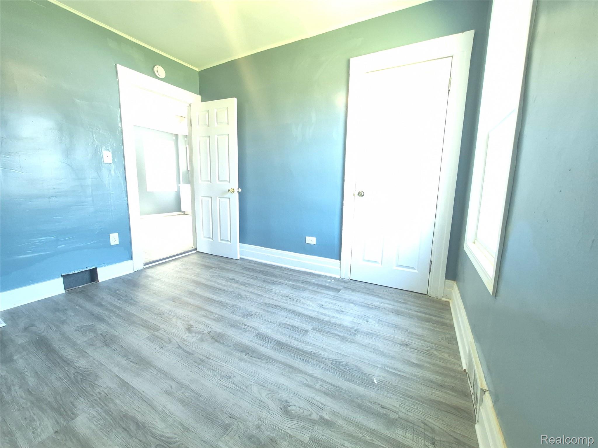 16758 Frazho Road Roseville, MI 48066 - Photo 20 of 53 Wood-finish flooring complemented by light blue walls