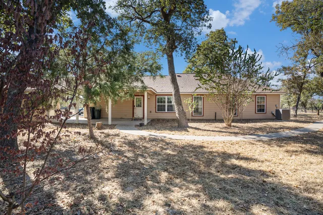front view of a house with a trees