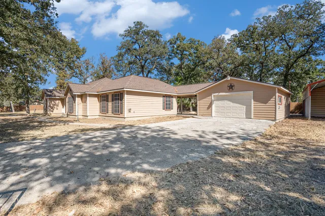 a house with trees in the background
